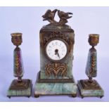 A RARE 19TH CENTURY EUROPEAN CARVED FLUORITE AND BRONZE CLOCK GARNITURE each stick overlaid with flo