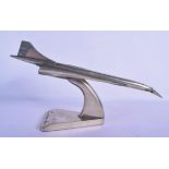 A VINTAGE 1970S CHROME CONCORDE MODEL upon a triangular plinth. 40 cm x 18 cm.