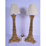 A PAIR OF 19TH CENTURY EUROPEAN GILT BRONZE CANDLESTICKS converted to lamps. 60 cm high overall.