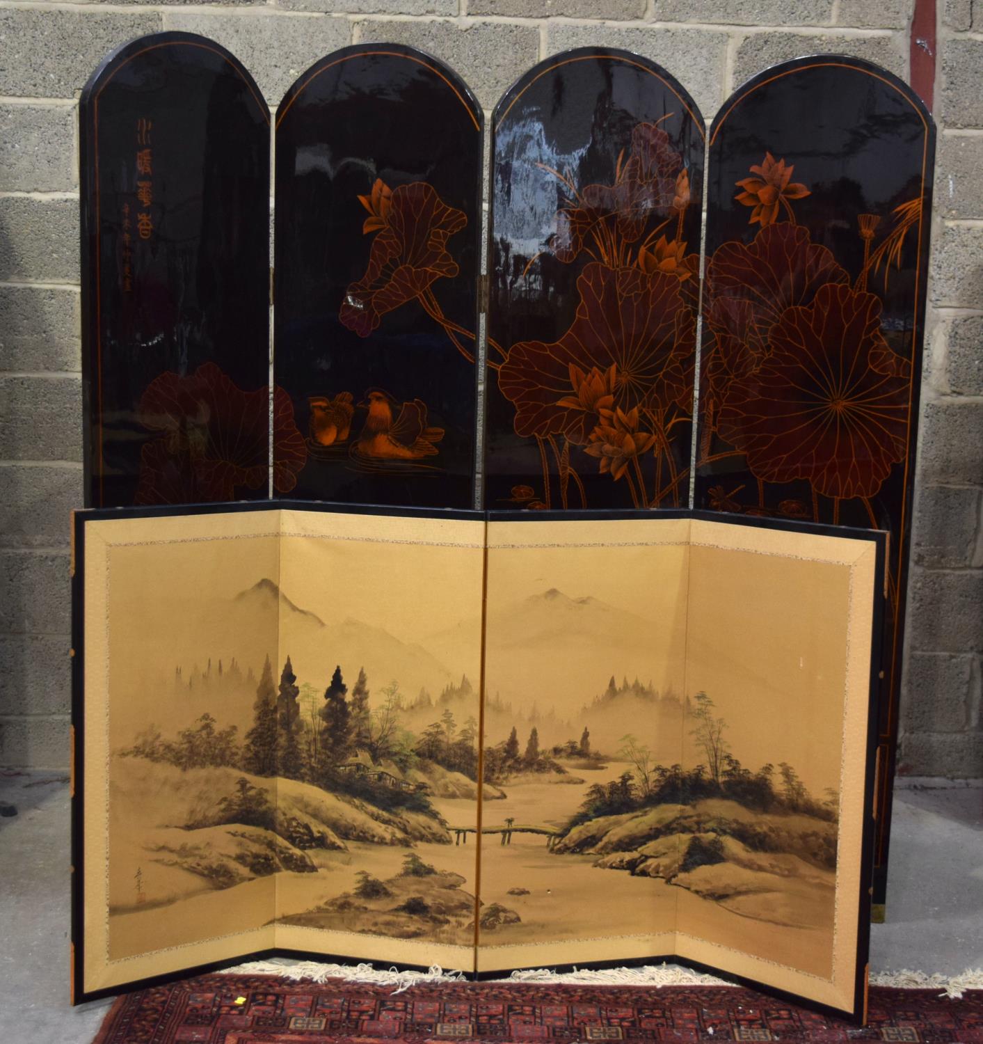 A LARGE JAPANESE BLACK LACQUERED FOUR FOLD SCREEN, decorated with ducks and foliage. Alongside a sma