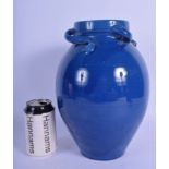 A RARE LIBERTY OF LONDON BLUE GLAZED POTTERY VASE with scrolling organic handles. 30 cm x 13 cm.