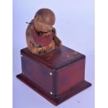 AN UNUSUAL EARLY 20TH CENTURY JAPANESE CARVED KOBE TOY modelled as a male eating melon. 10 cm x 5.5