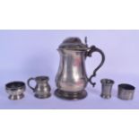 AN EARLY PEWTER TANKARD together with four other similar items. Largest 19 cm high. (5)