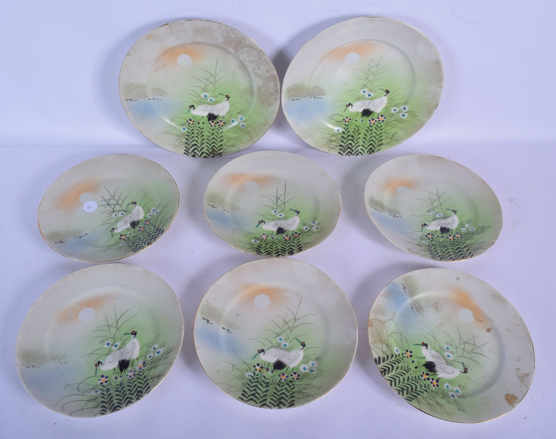 EIGHT EARLY 20TH CENTURY JAPANESE TAISHO PERIOD KUTANI PORCELAIN DISHES painted with birds. Largest