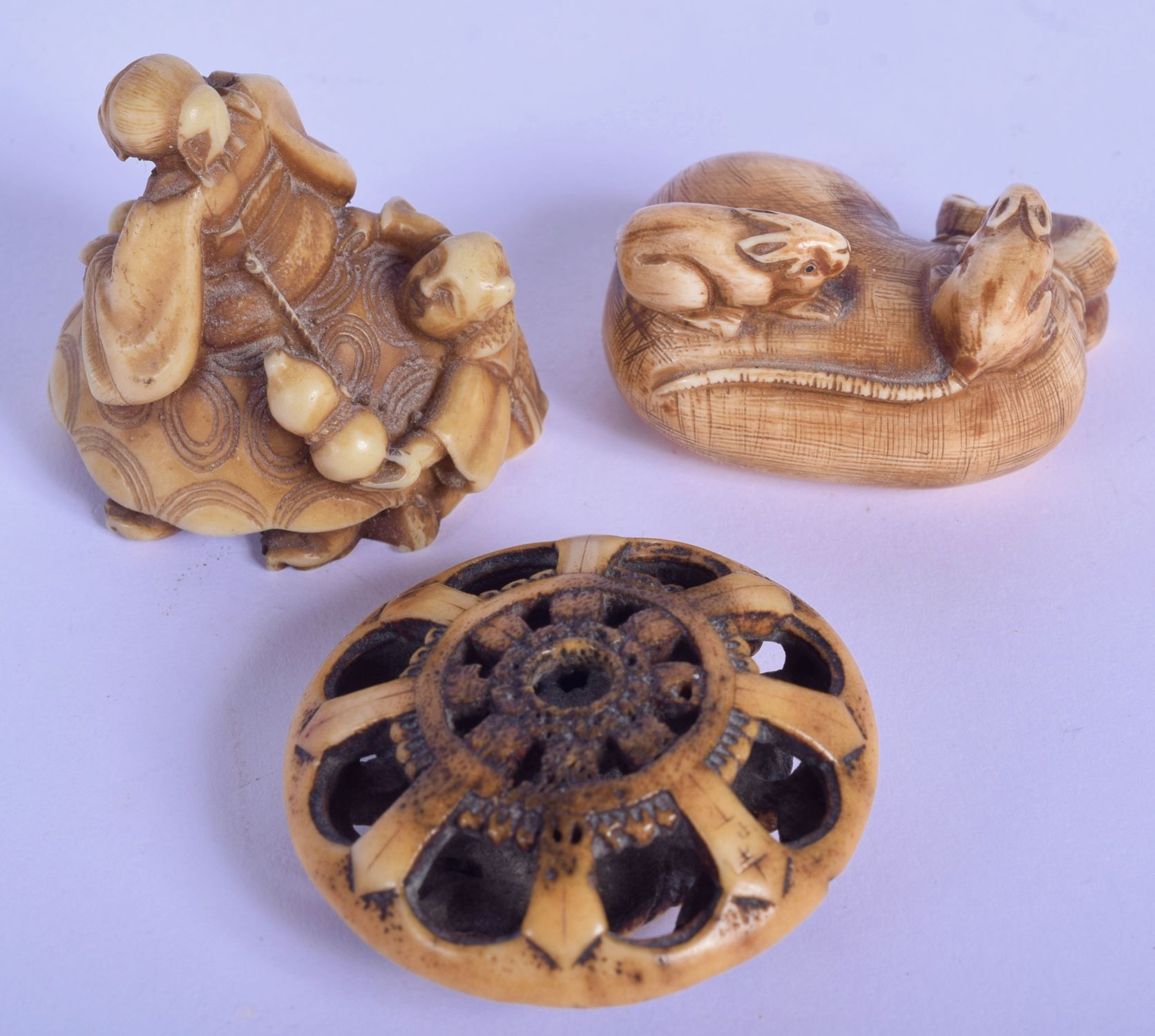 AN 18TH/19TH CENTURY JAPANESE EDO PERIOD CARVED STAG ANTLER MANJU NETSUKE together with a stone nets - Image 2 of 19