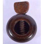 AN ANTIQUE TREEN FRUITWOOD SCREW ACTION NUT CRACKER. 6.5 cm x 4.5 cm.