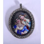 A FINE EARLY 20TH CENTURY EUROPEAN ENAMELLED SILVER PENDANT painted with lovers within an interior.