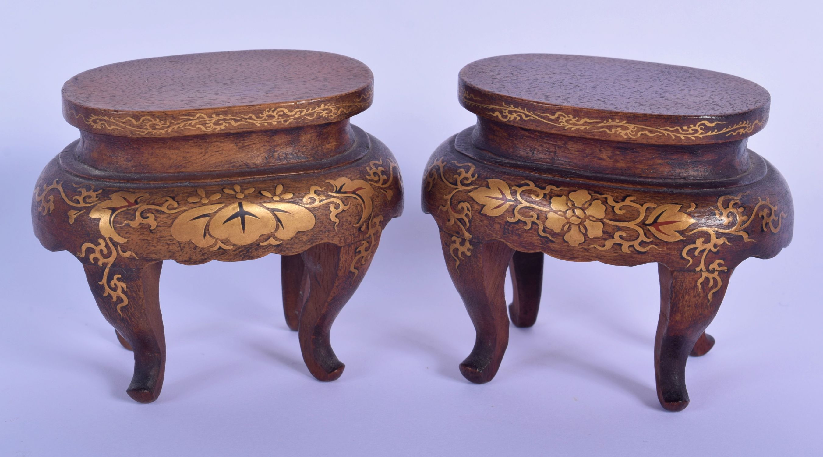 A PAIR OF 19TH CENTURY JAPANESE MEIJI PERIOD GOLD LACQUERED STANDS decorated with foliage. 8 cm x 8