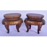 A PAIR OF 19TH CENTURY JAPANESE MEIJI PERIOD GOLD LACQUERED STANDS decorated with foliage. 8 cm x 8