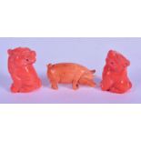 AN EARLY 20TH CHINESE CARVED CORAL FIGURE OF A PIG Late Qing/Republic, together with two similar bud