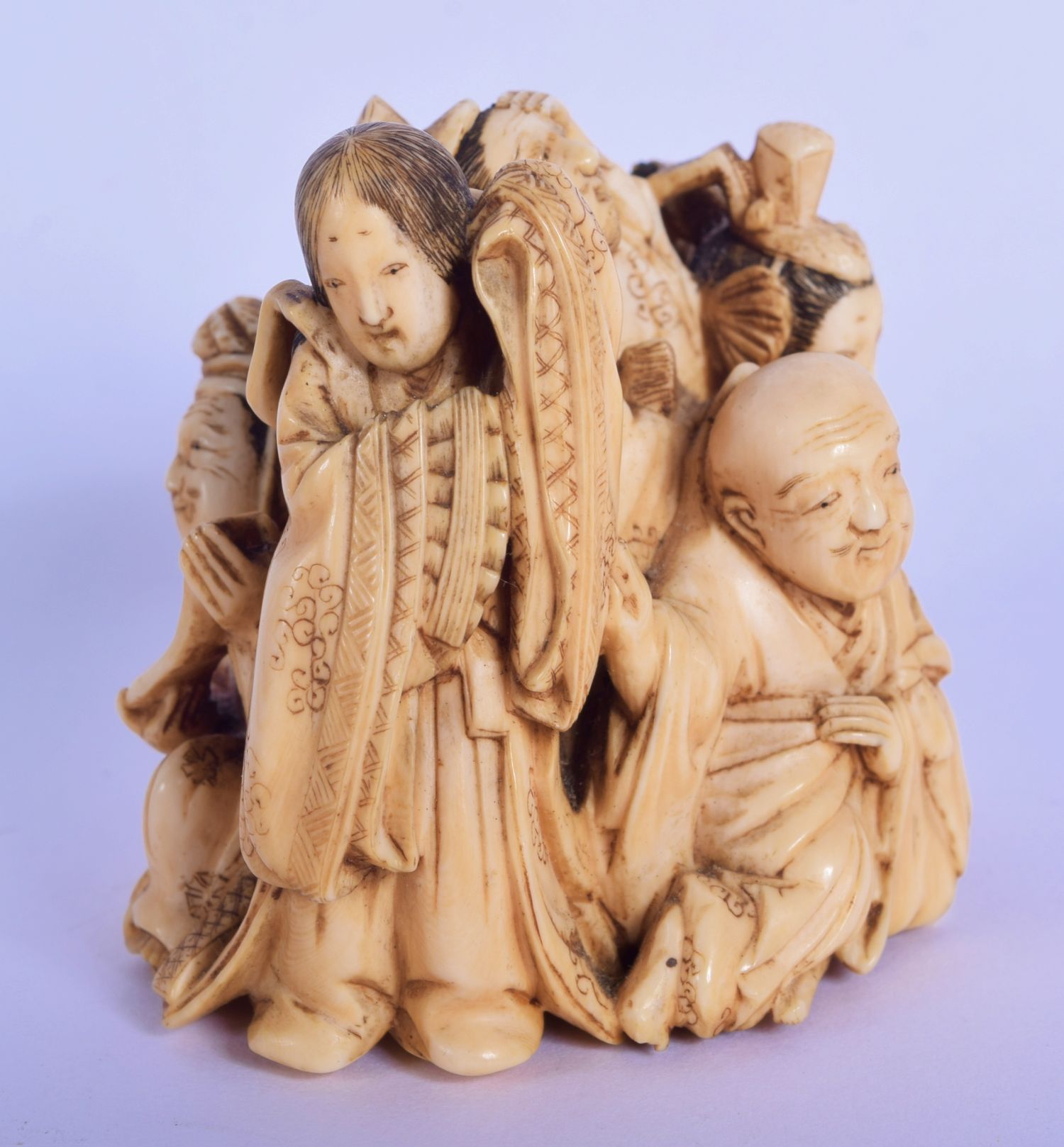 A FINE 19TH CENTURY JAPANESE MEIJI PERIOD CARVED IVORY OKIMONO modelled as various figures, includin - Image 4 of 5