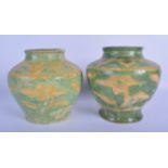 A PAIR OF CHINESE TANG DYNASTY EGG AND SPINACH SANCAI TYPE POTTERY VASES decorated with motifs. 19 c