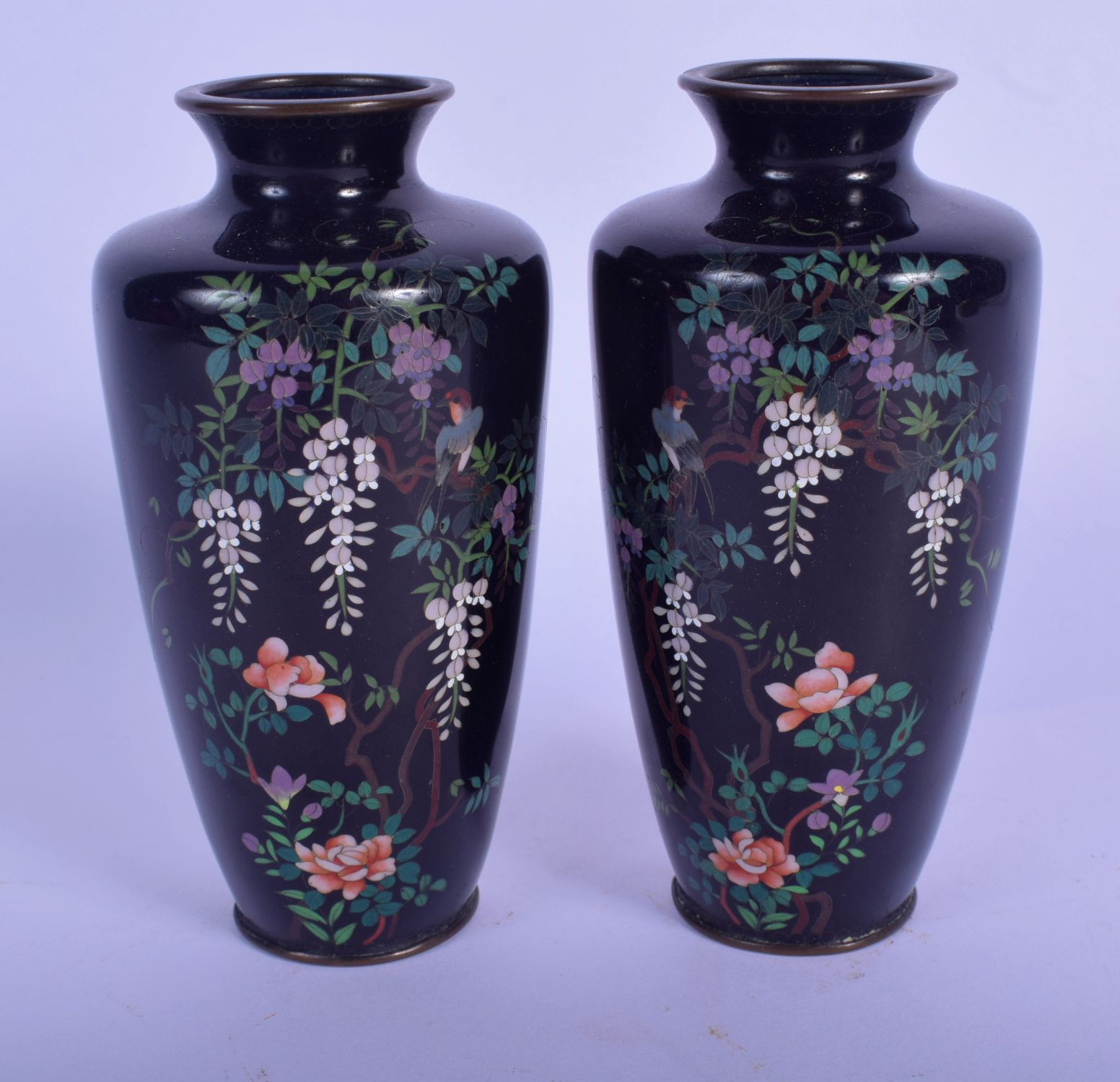 A PAIR OF EARLY 20TH CENTURY JAPANESE MEIJI PERIOD CLOISONNE ENAMEL VASES decorated with foliage. 13