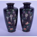 A PAIR OF EARLY 20TH CENTURY JAPANESE MEIJI PERIOD CLOISONNE ENAMEL VASES decorated with foliage. 13