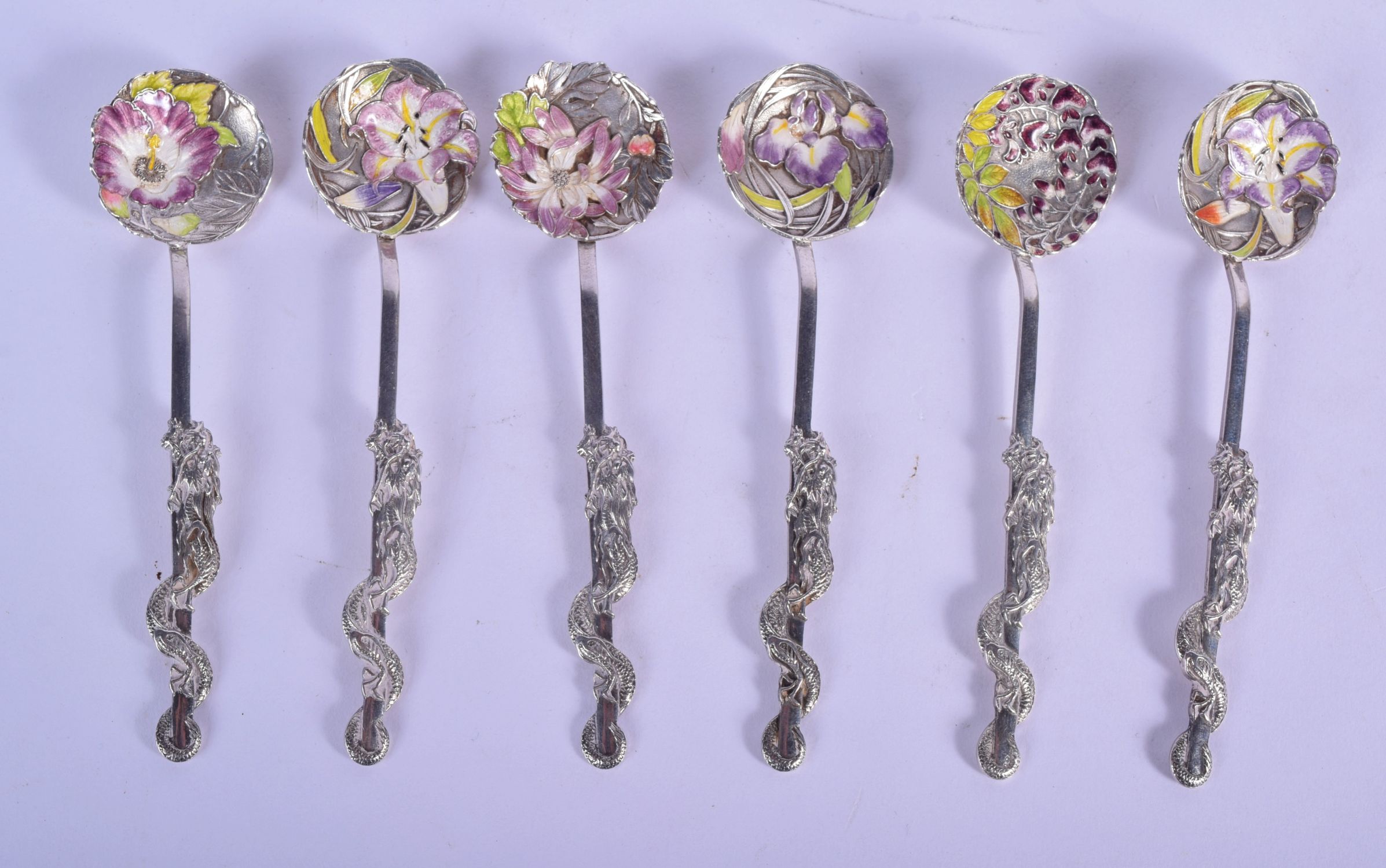 A LOVELY SET OF SIX LATE 19TH CENTURY JAPANESE MEIJI PERIOD SILVER AND ENAMEL SPOONS formed with dra
