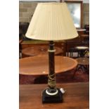 A MID 20TH CENTURY FAUX TORTOISESHELL TABLE LAMP possibly bakelite. 82 cm high.