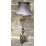 AN ANTIQUE CARVED CONTINENTAL BAROQUE CANDLESTICK LAMP. 134 cm including shade.