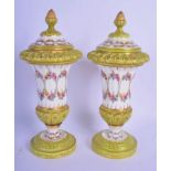 A PAIR OF 19TH CENTURY FRENCH PARIS PORCELAIN VASES AND COVERS Sevres Style, painted with flowers. 2