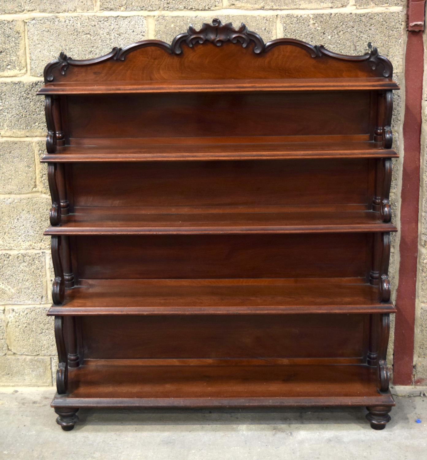 A VICTORIAN WATERFALL BOOKCASE decorated with scrolling supports and acanthus frieze. 150 x 125 x 32