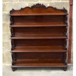 A VICTORIAN WATERFALL BOOKCASE decorated with scrolling supports and acanthus frieze. 150 x 125 x 32