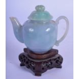 A FINE EARLY 20TH CENTURY CHINESE CARVED ICEY JADEITE TEAPOT AND COVER with lotus type finial and sl