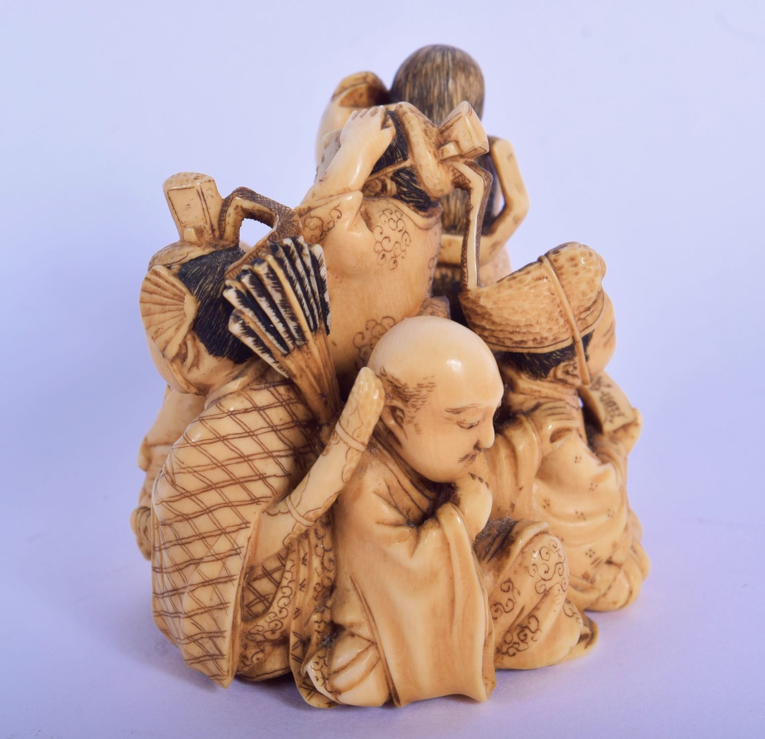 A FINE 19TH CENTURY JAPANESE MEIJI PERIOD CARVED IVORY OKIMONO modelled as various figures, includin - Image 2 of 5