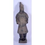 A CHINESE CLAY POTTERY FIGURE OF A TERRACOTTA WARRIOR. 17 cm high.