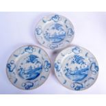 THREE 18TH CENTURY ENGLISH DELFT BLUE AND WHITE PLATES painted with Oriental landscapes. 22 cm diame