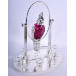 A LARGE CONTINENTAL SILVER PLATED RUBY GLASS DECANTER SET modelled as a swinging bird. 3390 grams. 4