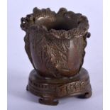 A BRONZE LEAF SHAPED CAULDRON WITH AN INSECT ON TOP. 4.8cm x 4.2cm, weight 102.6g