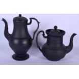 TWO 19TH CENTURY ENGLISH BLACK BASALT COFFEE POTS one with engine turned decoration, the other with