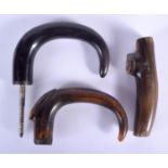 A 19TH CENTURY MIDDLE EASTERN CARVED RHINOCEROS HORN HANDLE together with two other buffalo horn han