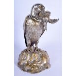 A 19TH CENTURY EUROPEAN SILVERED BRONZE EAGLE INKWELL of naturalistic form. 21 cm high.