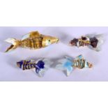 FOUR ARTICULATED CLOISONNE FISH. Largest 8.8cm x 3cm, weight 31g