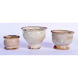 THREE 17TH/18TH CENTURY ENGLISH DELFT OINTMENT POTS in various forms. Largest 6 cm x 7 cm. (3)