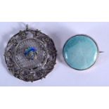 AN ARTS AND CRAFTS SILVER AND ENAMEL BROOCH and Ruskin brooch. 11 grams. Largest 4 cm wide. (2)
