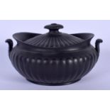 A WEDGWOOD BLACK BASALT TWIN HANDLED SUGAR BOX AND COVER with scrolling handles. 14 cm x 11 cm.
