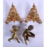 A PAIR OF ANTIQUE BRONZE PUTTI and two gilt metal mounts. (4)