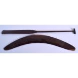 AN AUSTRALIAN TRIBAL PADDLE together with a boomerang. Largest 50 cm long. (2)