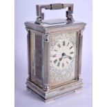 A MAPPIN & WEBB SILVER PLATED CARRIAGE CLOCK with open work front plate. 15 cm high inc handle.