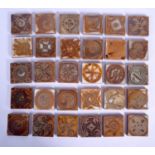 A SET OF THIRTY ALDERMASTON POTTERY 2-inch LUSTRE TILES painted by various potters. Each 2 inches/5