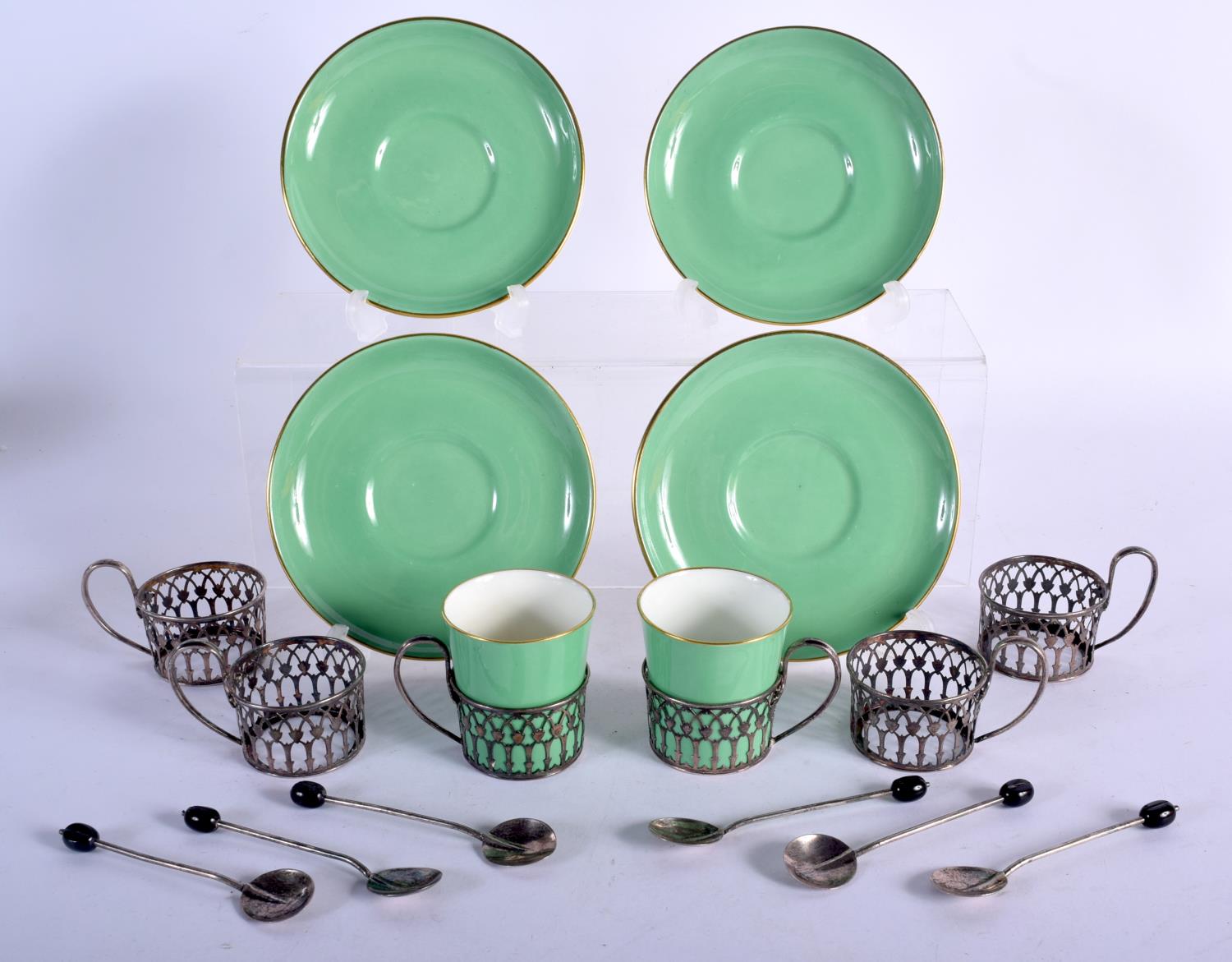 SIX SILVER CUP HOLDERS AND COFFEE SPOONS WITH 2 PARAGON CUPS AND 4 SAUCERS WITH AN ASSOCIATED CASE.