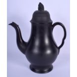 A 19TH CENTURY BLACK BASALT COFFEE POT AND COVER with reeded widow knop finial, the handle and spout