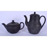 A WEDGWOOD BLACK BASALT TEAPOT AND COVER decorated with classical figures, together with a Wedgwood