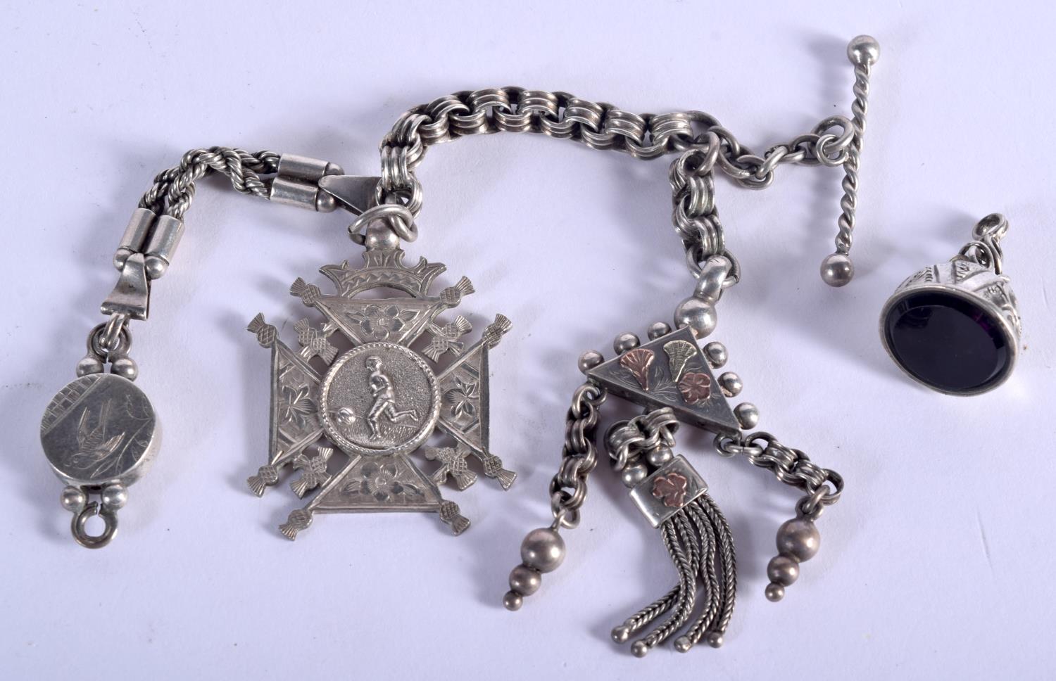 AN ANTIQUE SILVER CHARM CHAIN. Birmingham 1888. 41 grams. 18 cm long.