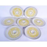 A SET OF SEVEN ALDERMASTON POTTERY ASPARAGUS OR DIP PLATES, unsigned, painted with a yellow circular