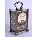 AN ANTIQUE SILVER PLATED CARRIAGE CLOCK decorated with figures and foliage. 9.5 cm high inc handle.