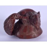 A JAPANESE RAT WOOD NETSUKE. 3 cm x 8 cm.