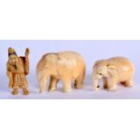 TWO ANTIQUE IVORY ELEPHANTS together with a similar man. 38 grams. 4 cm x 3 cm. (3)