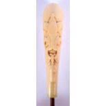 A LARGE 19TH CENTURY EUROPEAN CARVED IVORY HANDLED WALKING CANE decorated with motifs. 15 cm long.